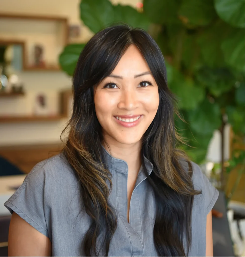 Dr. Tammy Vo, optometrist and founder of Look + See Vision Care, smiling in the office